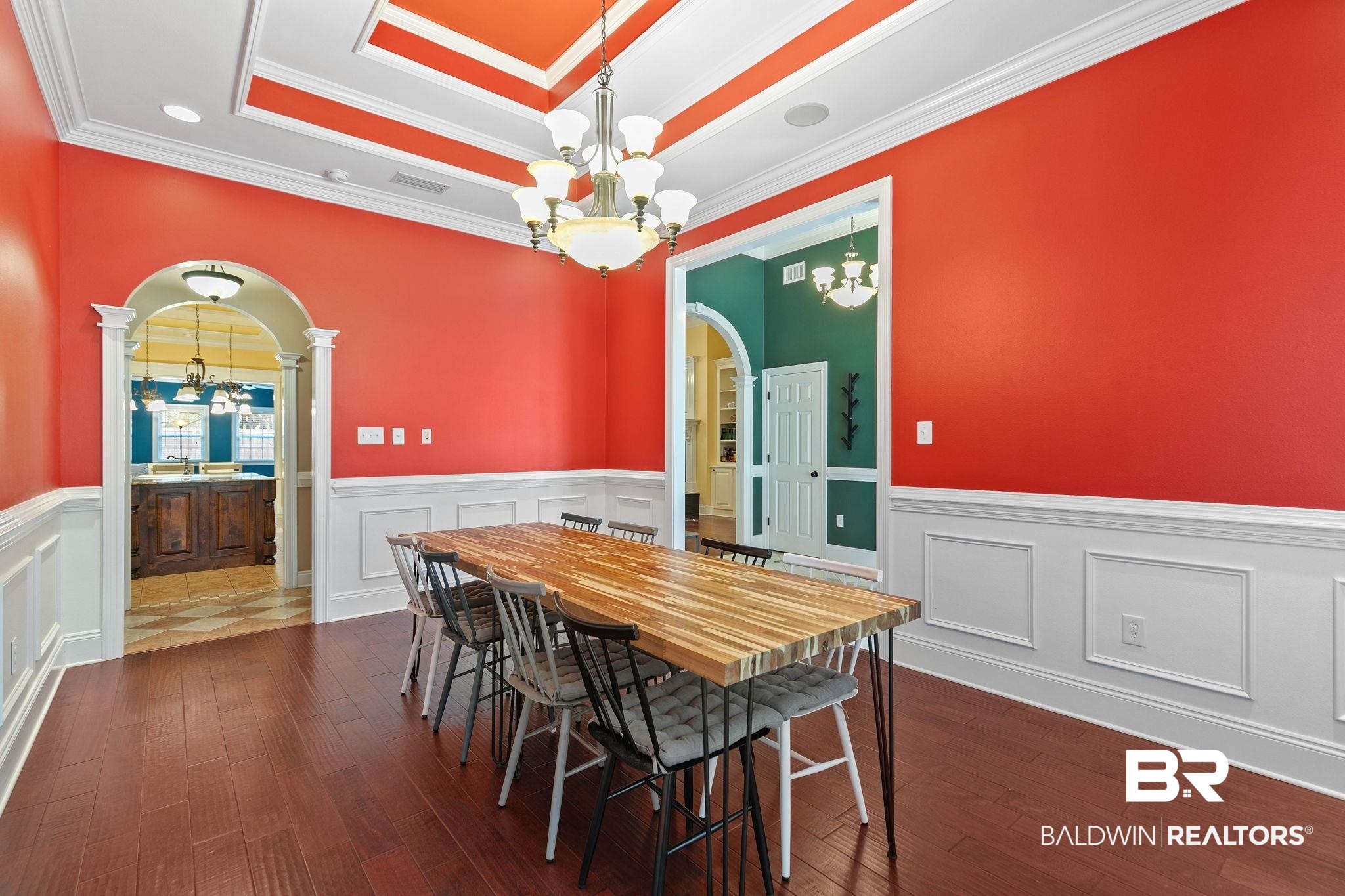 3668 Claridge Road North Mobile, AL 36608 - Photo 31 of 100 Dining space with suspended lighting, wainscoting, arched walkways, dark wood-style floors, and ornamental molding