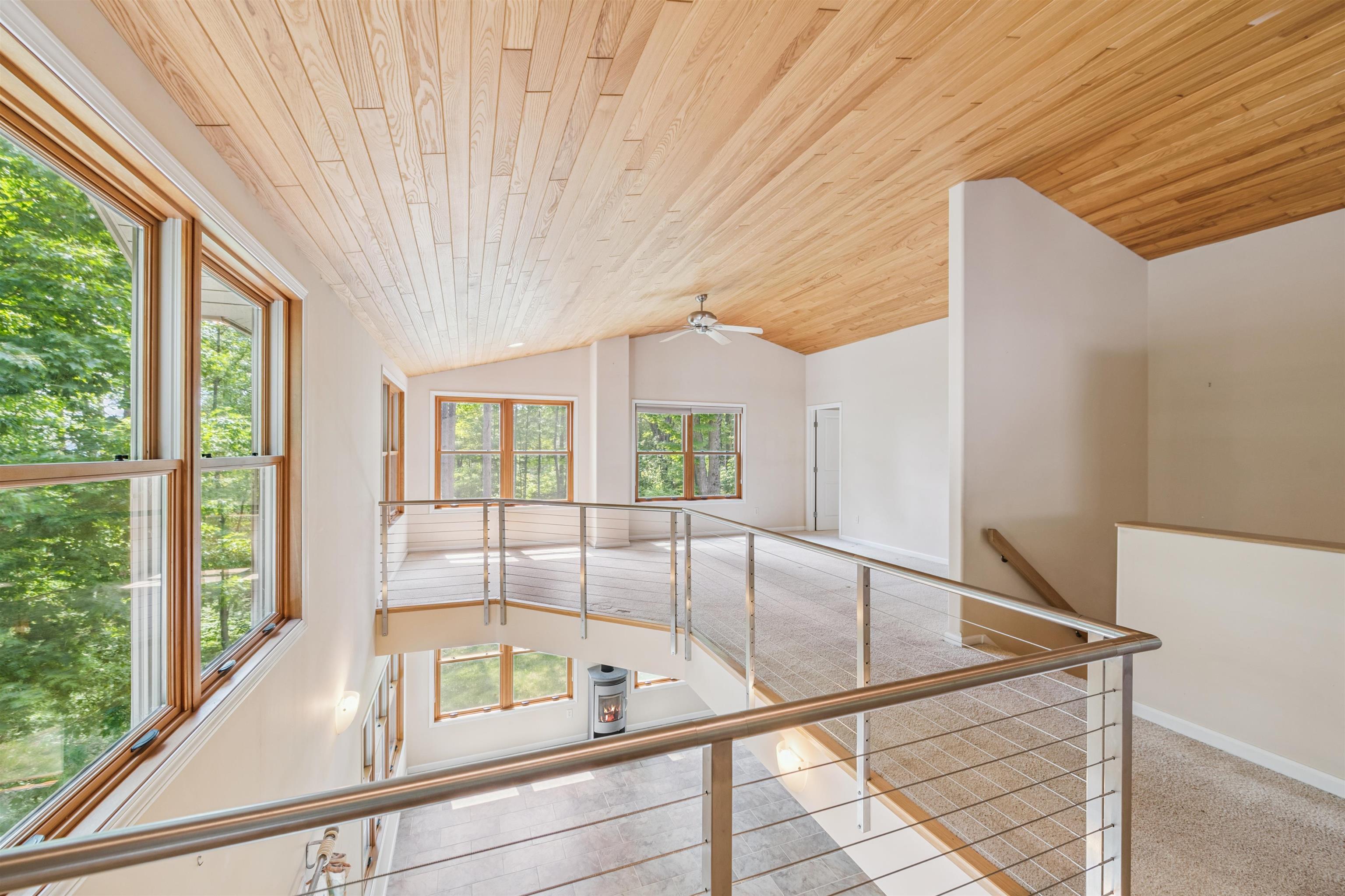 720 Rice Avenue Bayfield, WI 54814 - Photo 21 of 47 Hall featuring an upstairs landing, wood ceiling, lofted ceiling, and carpet flooring