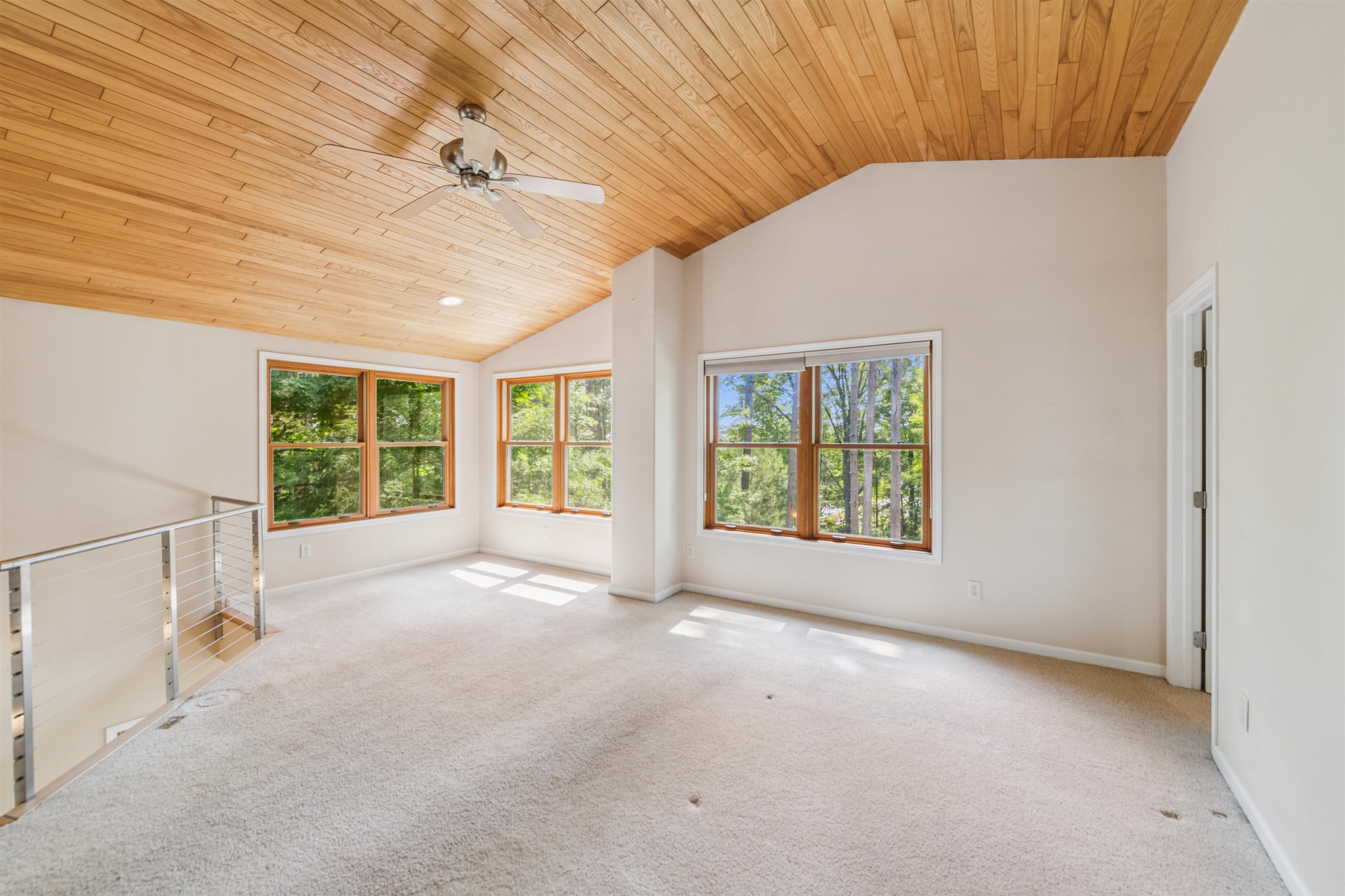 720 Rice Avenue Bayfield, WI 54814 - Photo 22 of 47 Carpeted empty room with wooden ceiling, vaulted ceiling, and ceiling fan