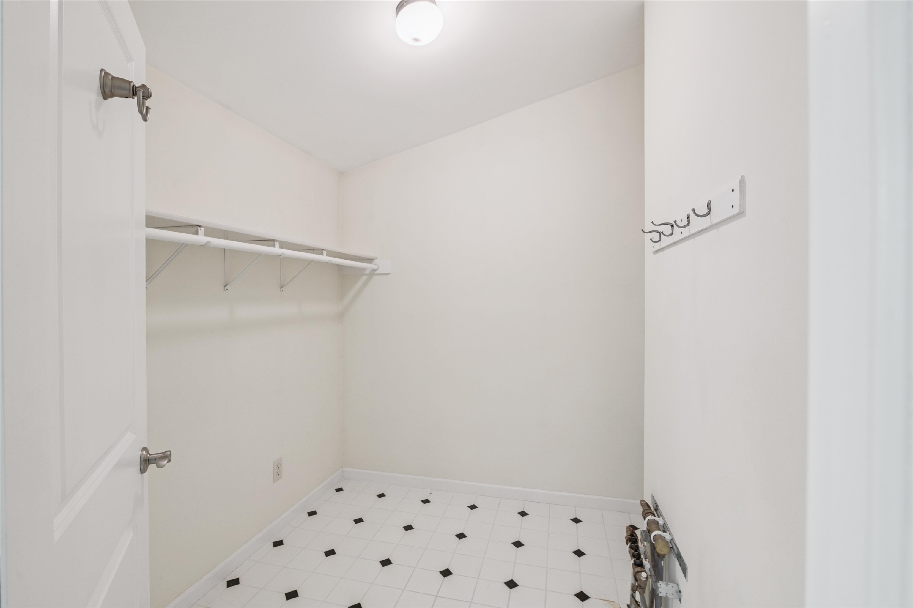 720 Rice Avenue Bayfield, WI 54814 - Photo 26 of 47 Spacious closet featuring tile patterned floors