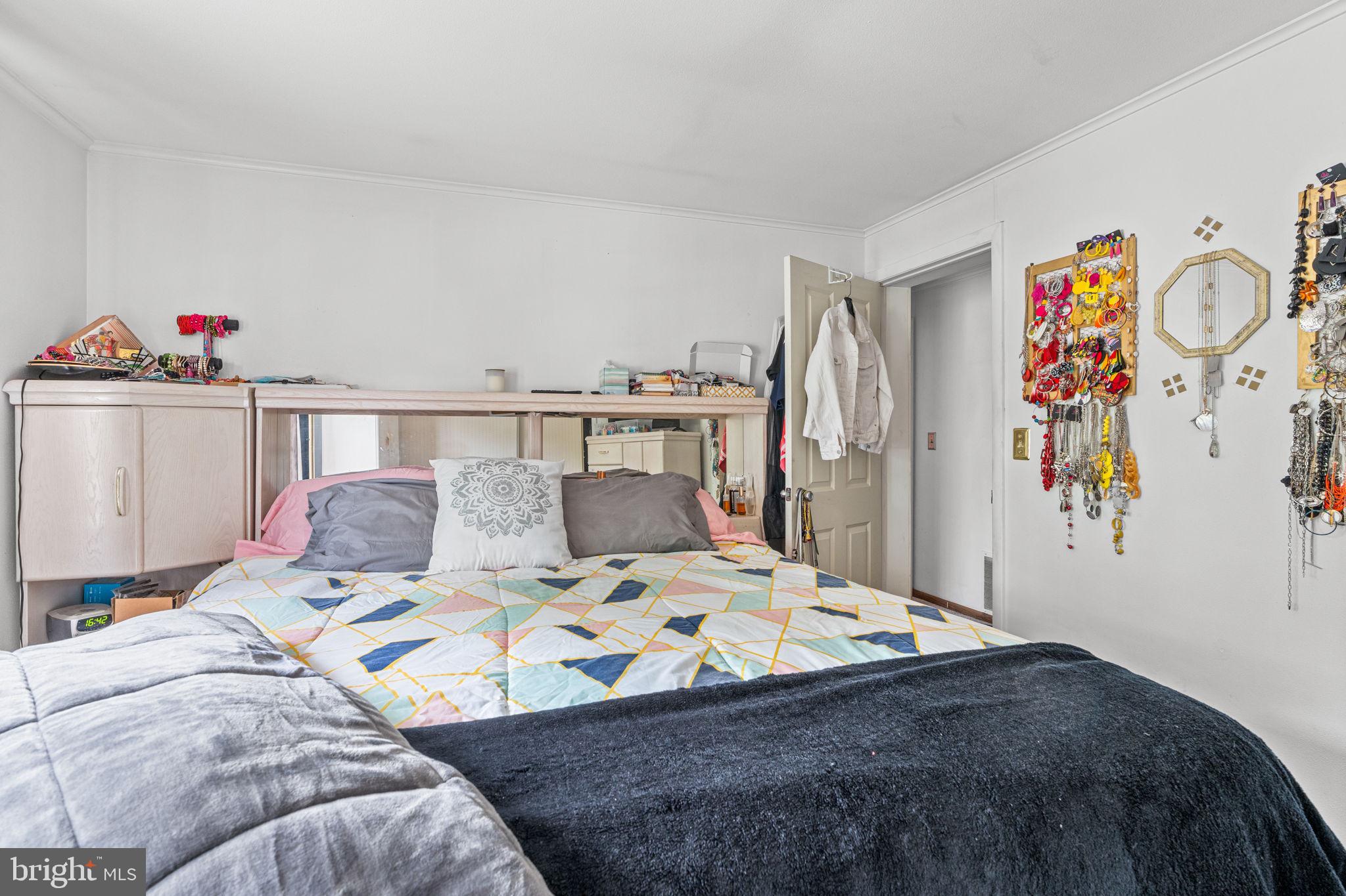 3212 Trinity Road Harrisburg, PA 17109 - Photo 13 of 23 a bedroom with a bed and book shelf