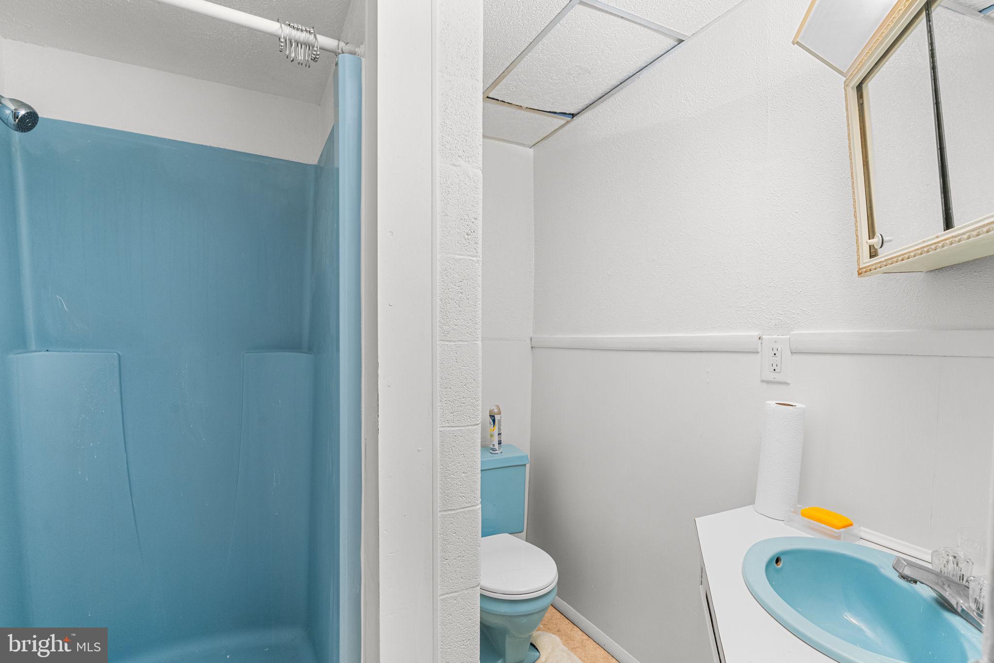 3212 Trinity Road Harrisburg, PA 17109 - Photo 19 of 23 a white toilet sitting next to a bathroom sink and a vanity