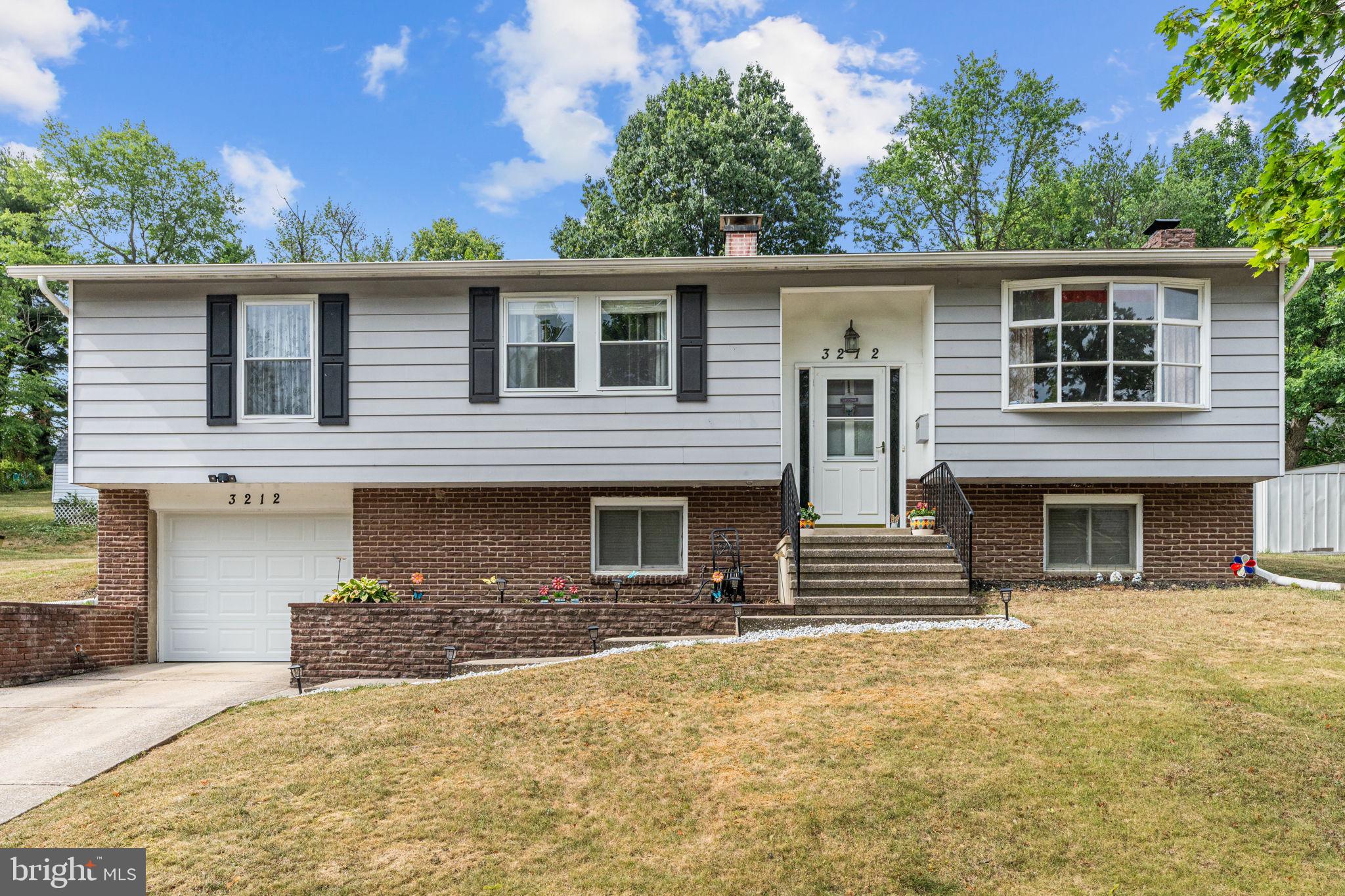 3212 Trinity Road Harrisburg, PA 17109 - Photo 4 of 23 front view of a house with a yard
