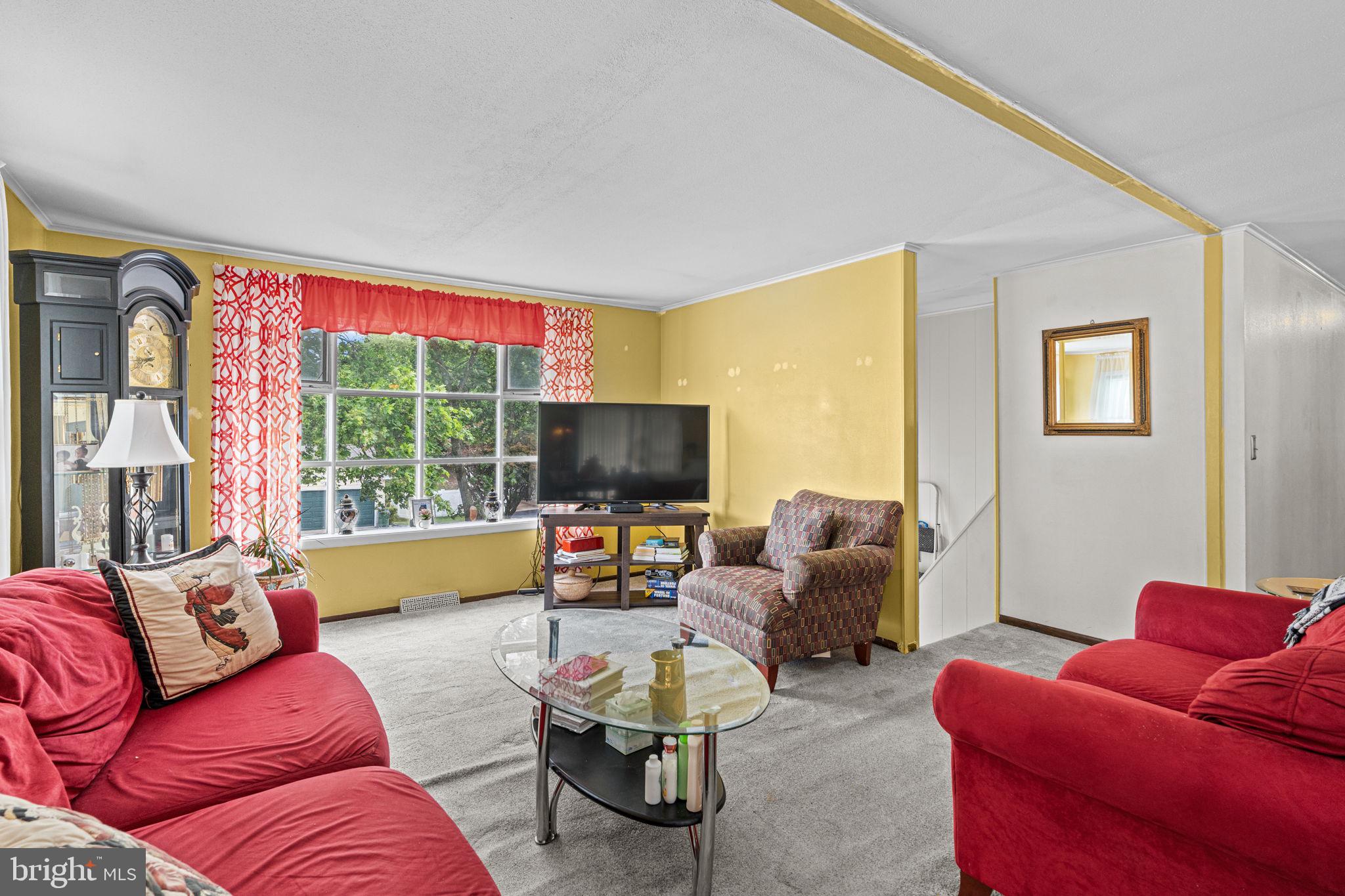 3212 Trinity Road Harrisburg, PA 17109 - Photo 6 of 23 a living room with furniture and a flat screen tv