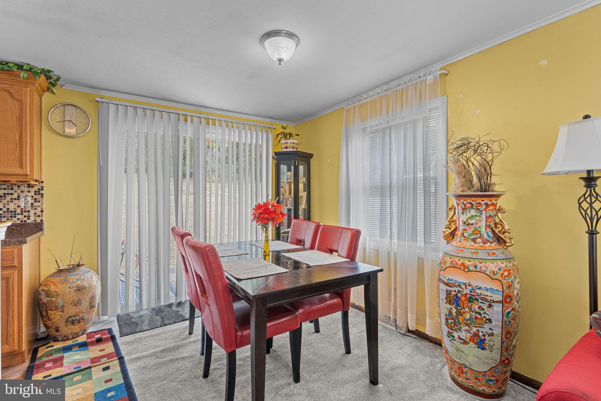 3212 Trinity Road Harrisburg, PA 17109 - Photo 7 of 23 a view of a dining room with furniture and a window