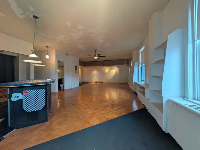 a view of kitchen and living room with furniture