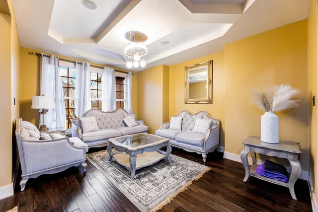 a living room with furniture and a fireplace