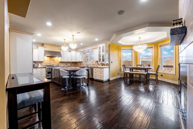 a kitchen with a table and chairs