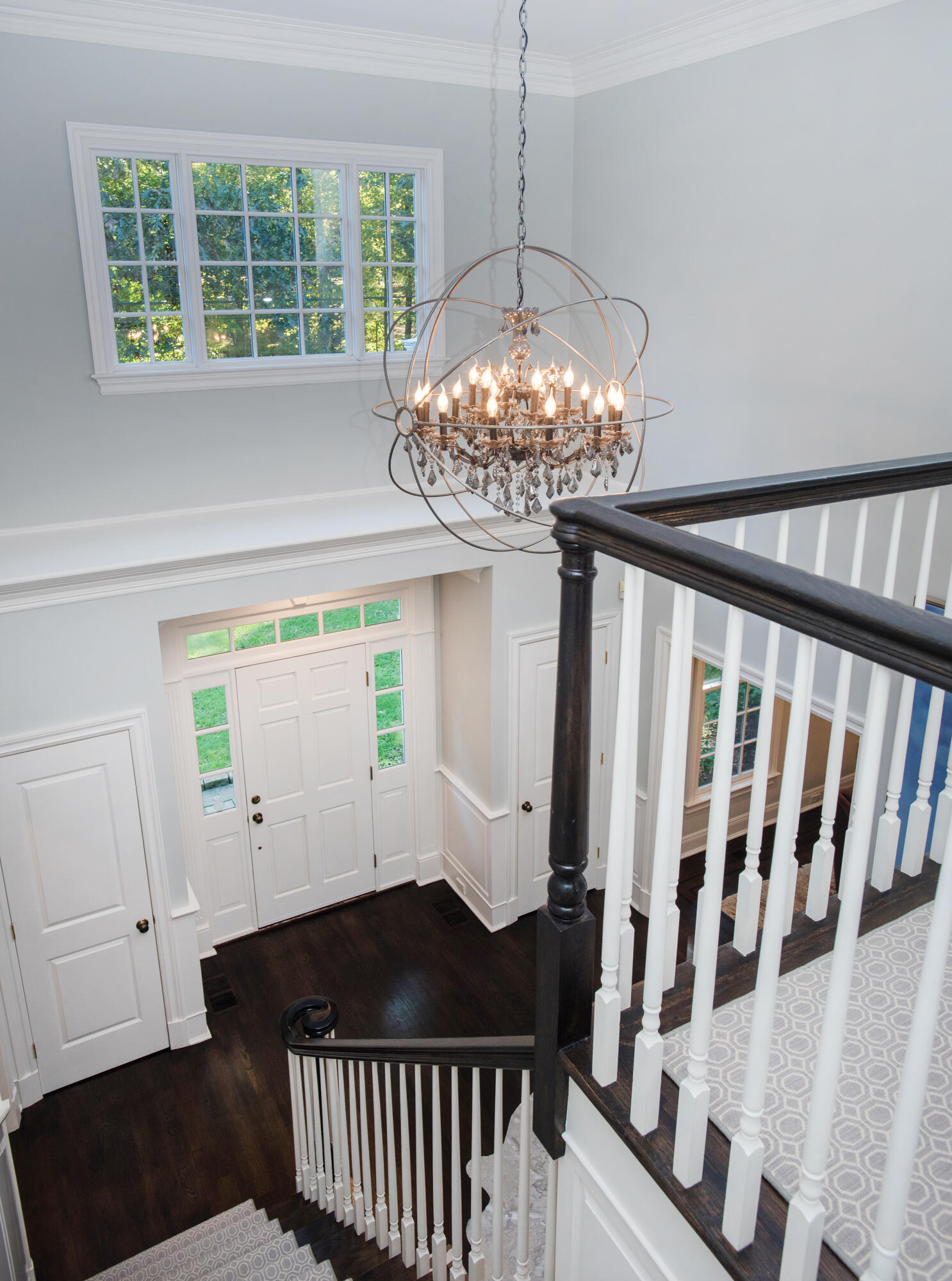 60 Bowery Road New Canaan, CT 06840 - Photo 15 of 49 a bedroom with a bed and a chandelier