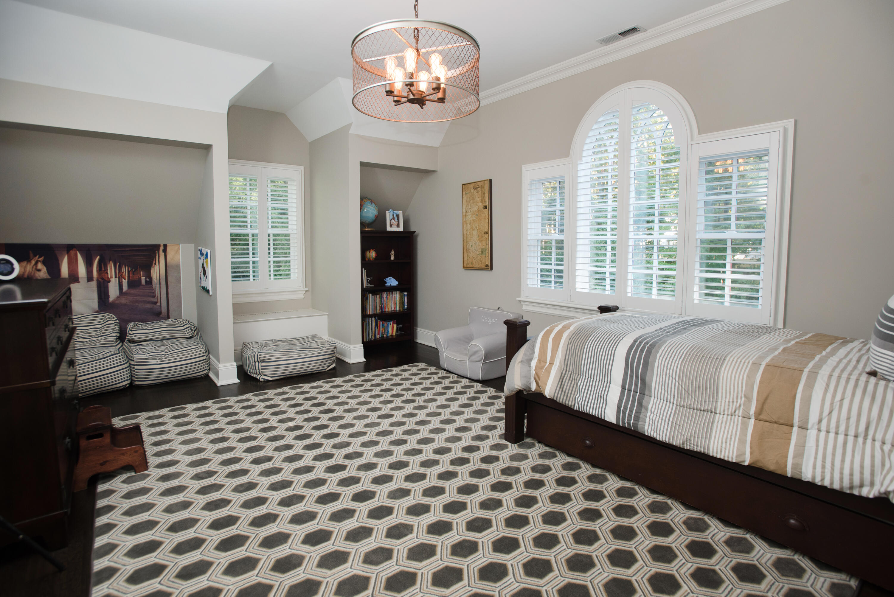 60 Bowery Road New Canaan, CT 06840 - Photo 24 of 49 a bedroom with a bed and a chandelier