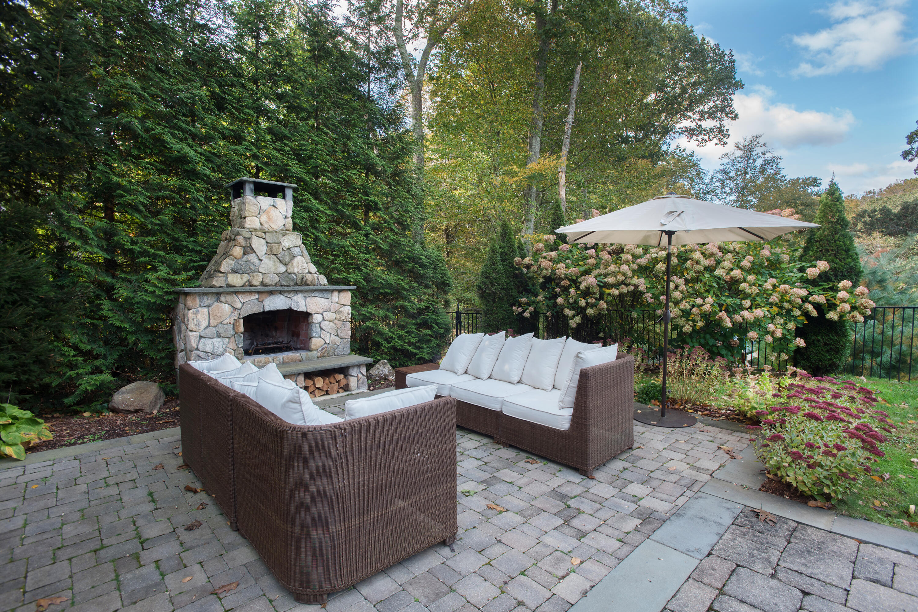 60 Bowery Road New Canaan, CT 06840 - Photo 44 of 49 a view of a couches in patio and a backyard