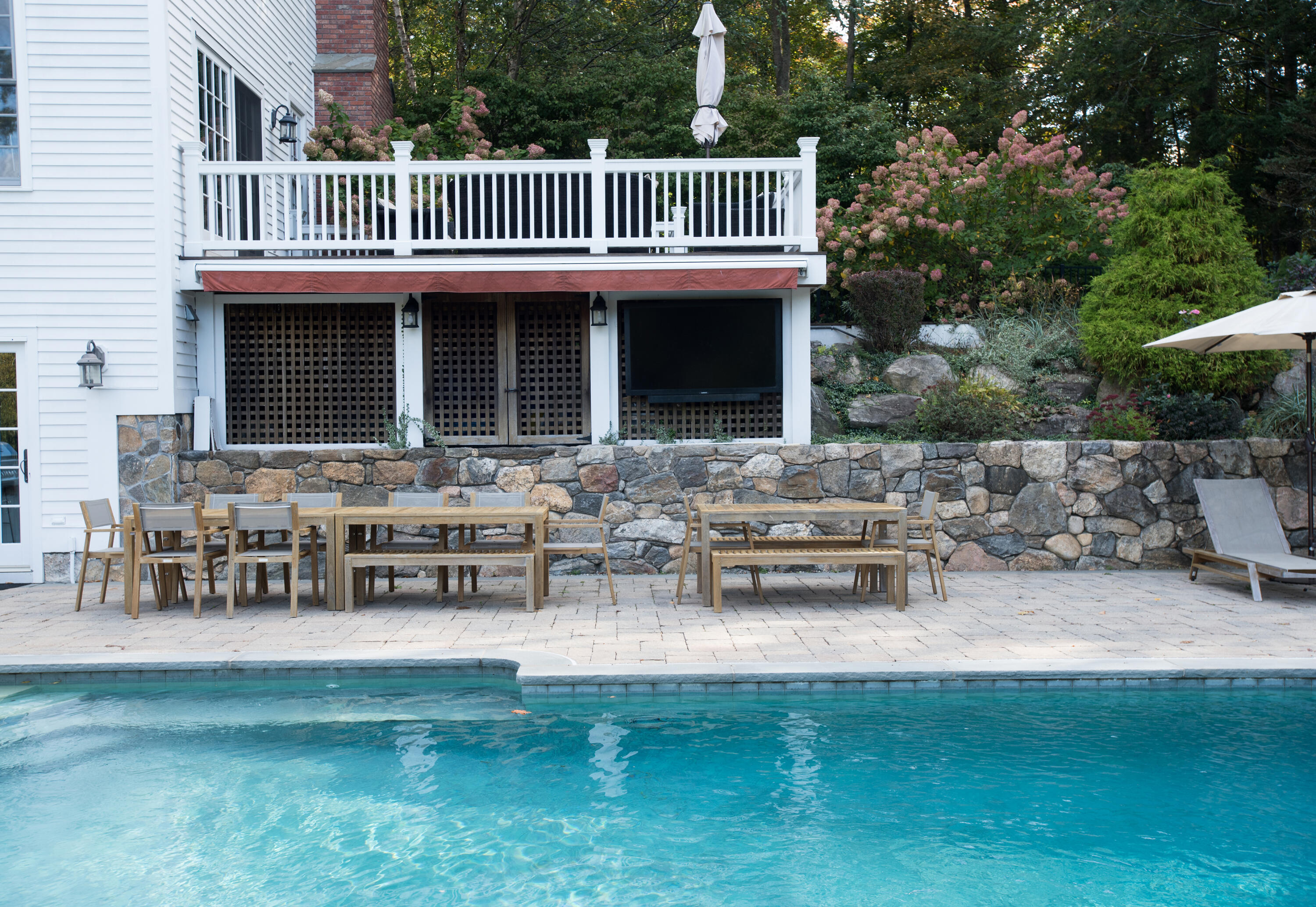 60 Bowery Road New Canaan, CT 06840 - Photo 46 of 49 a view of a house with a deck and a patio