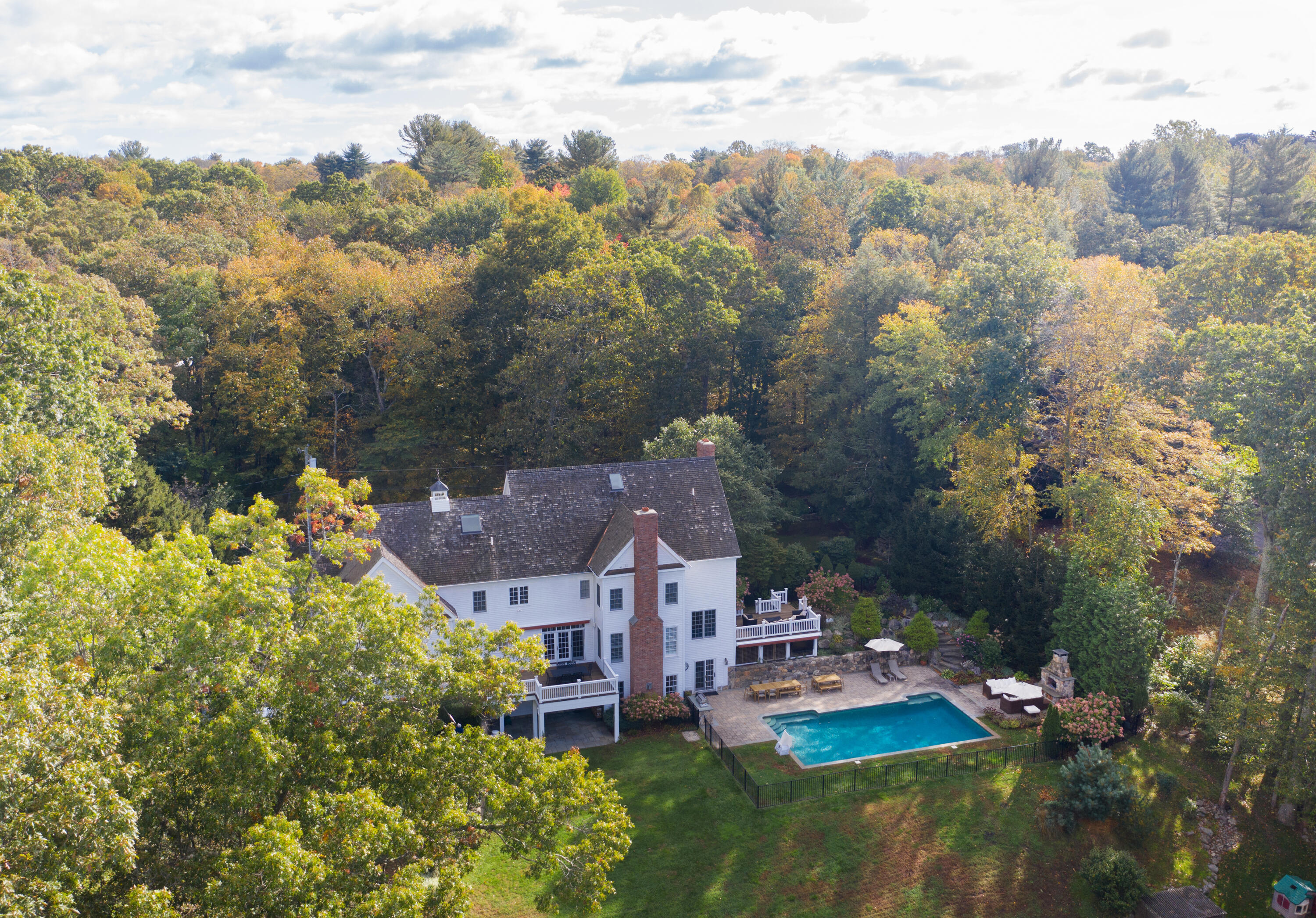 60 Bowery Road New Canaan, CT 06840 - Photo 48 of 49 an aerial view of a house with a garden and lake view