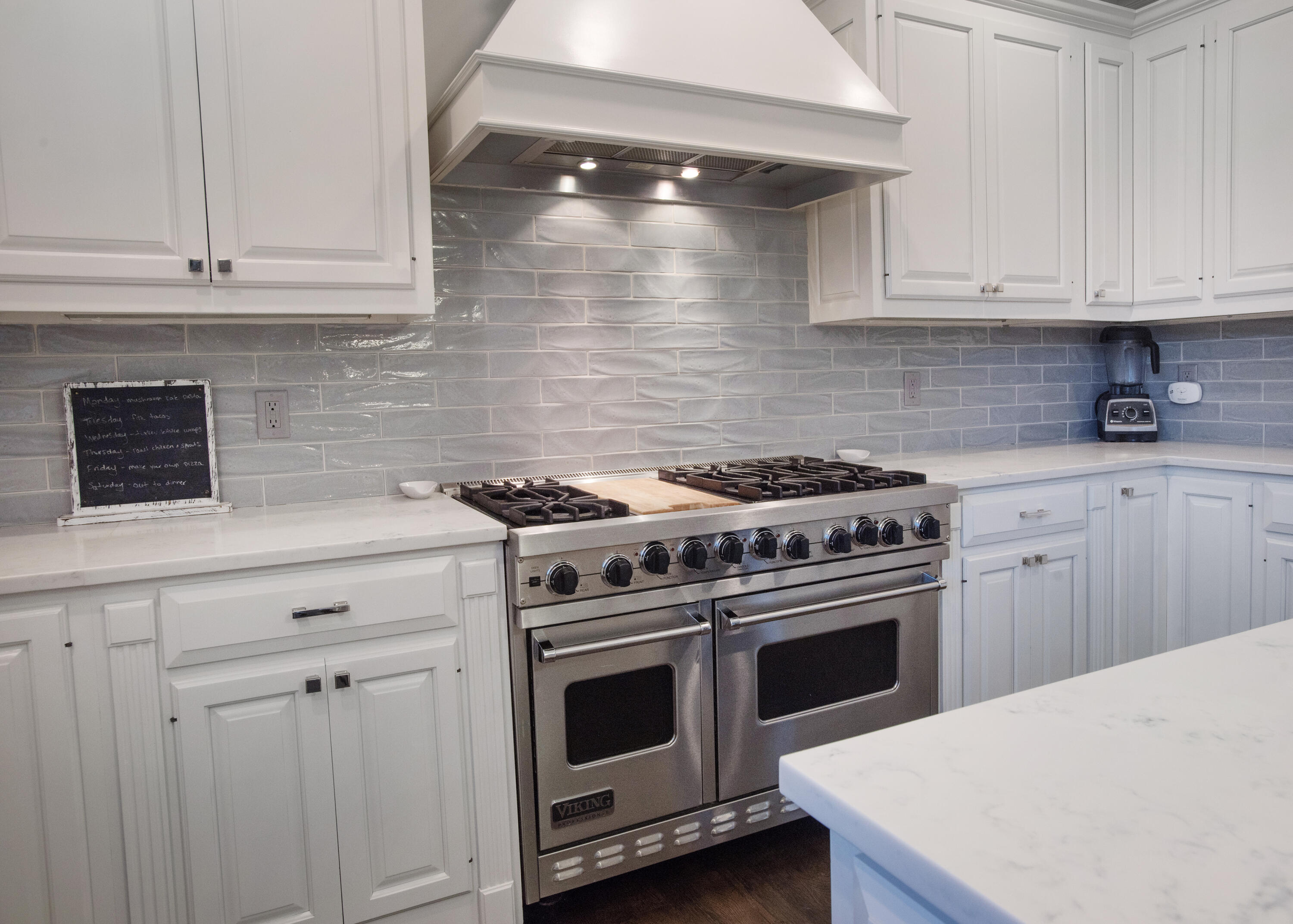 60 Bowery Road New Canaan, CT 06840 - Photo 7 of 49 a kitchen with granite countertop white cabinets and stainless steel appliances