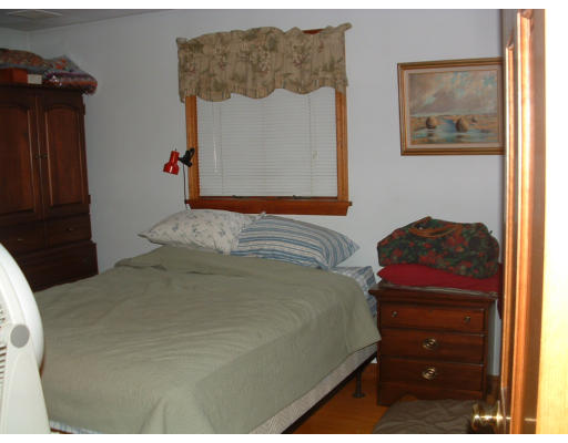15 Seabrook Road Salisbury, MA 01952 - Photo 4 of 5 a bedroom with a bed and a painting on the wall