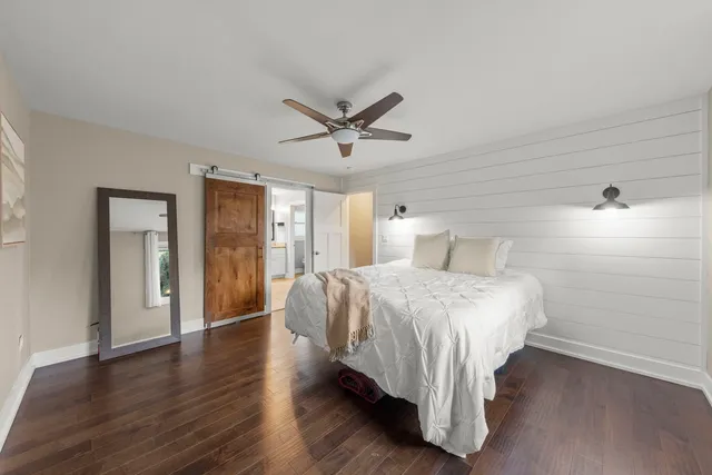 a bed room with a bed and a window