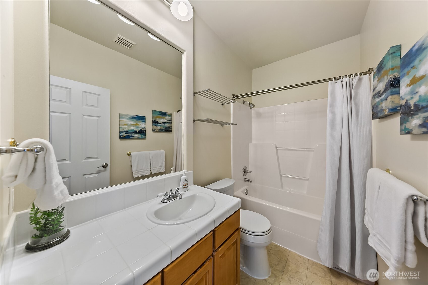 20604 Damson Road Lynnwood, WA 98036 - Photo 15 of 24 a bathroom with a granite countertop sink toilet and shower