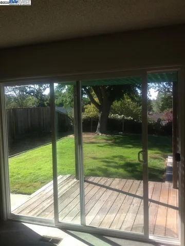 a view of a porch and garden
