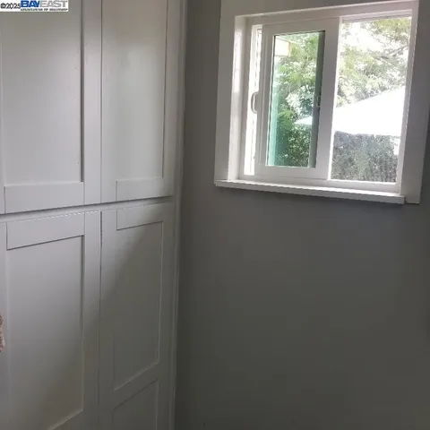 a view of a closet area with closet