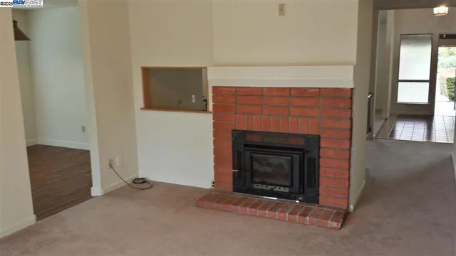 a living room with a fireplace