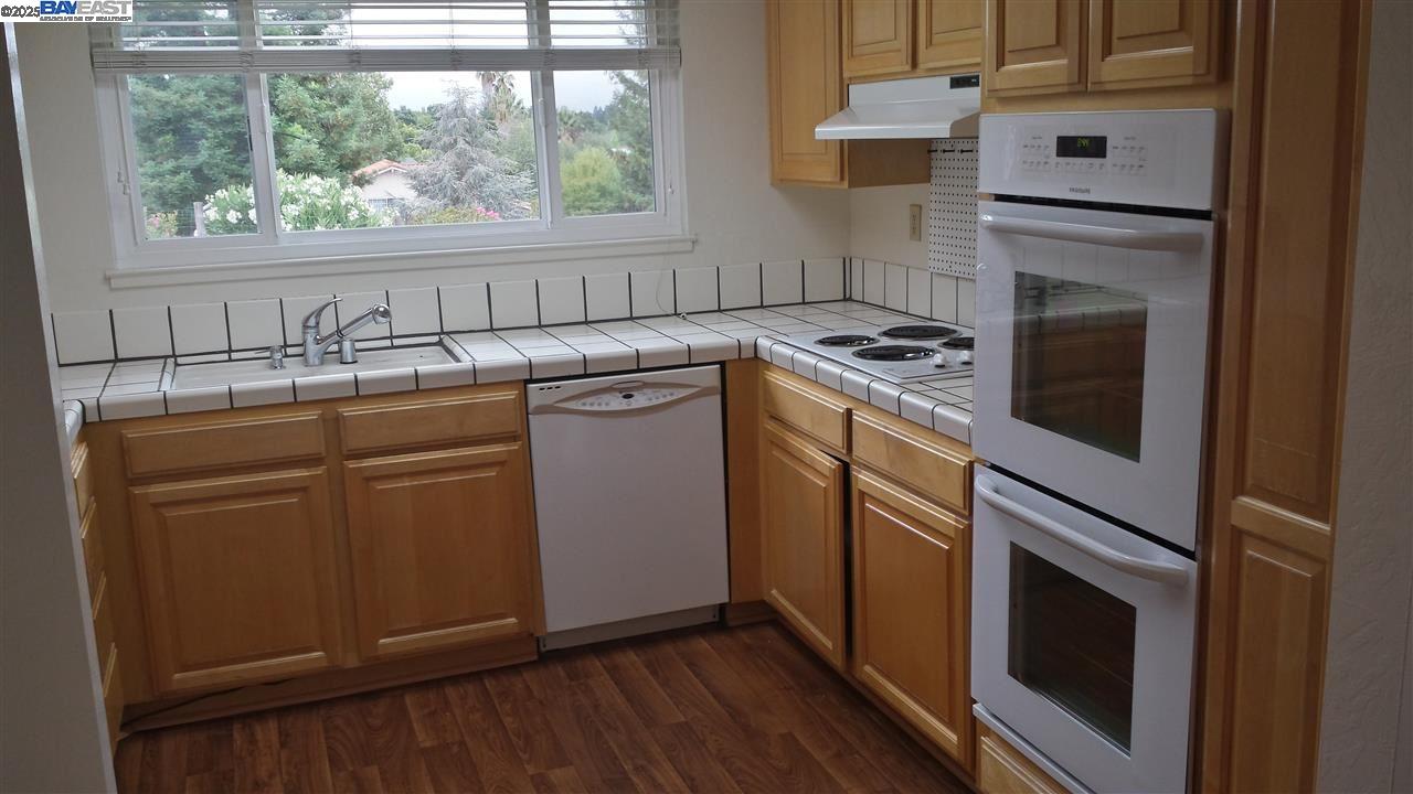 Danville Place Danville, CA 94526 - Photo 6 of 26 a kitchen with cabinets a sink and appliances