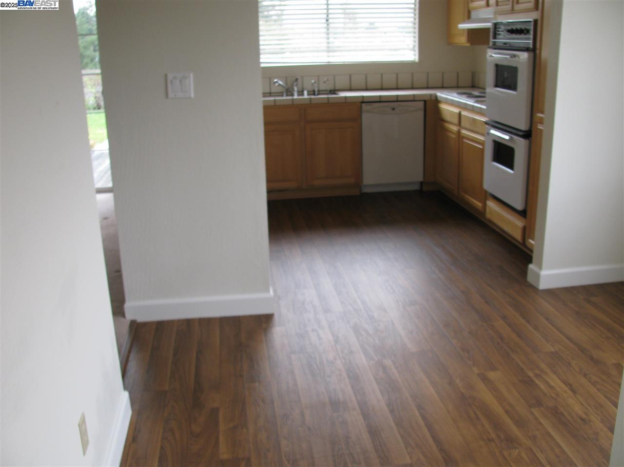 Danville Place Danville, CA 94526 - Photo 8 of 26 a view of a kitchen with wooden floor and electronic appliances