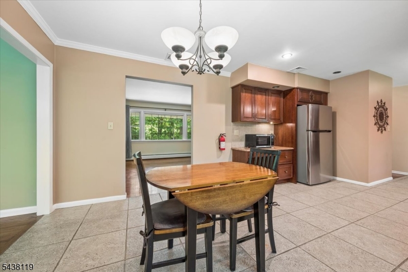 335 Drakestown Road Long Valley, NJ 07853 - Photo 12 of 34 a view of a dining room with furniture and a chandelier