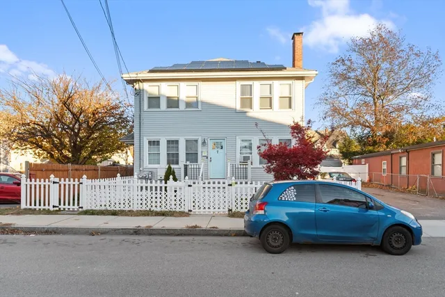 a car parked in front of a house