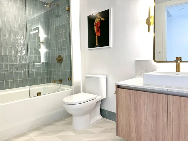 a bathroom with a sink and bathtub