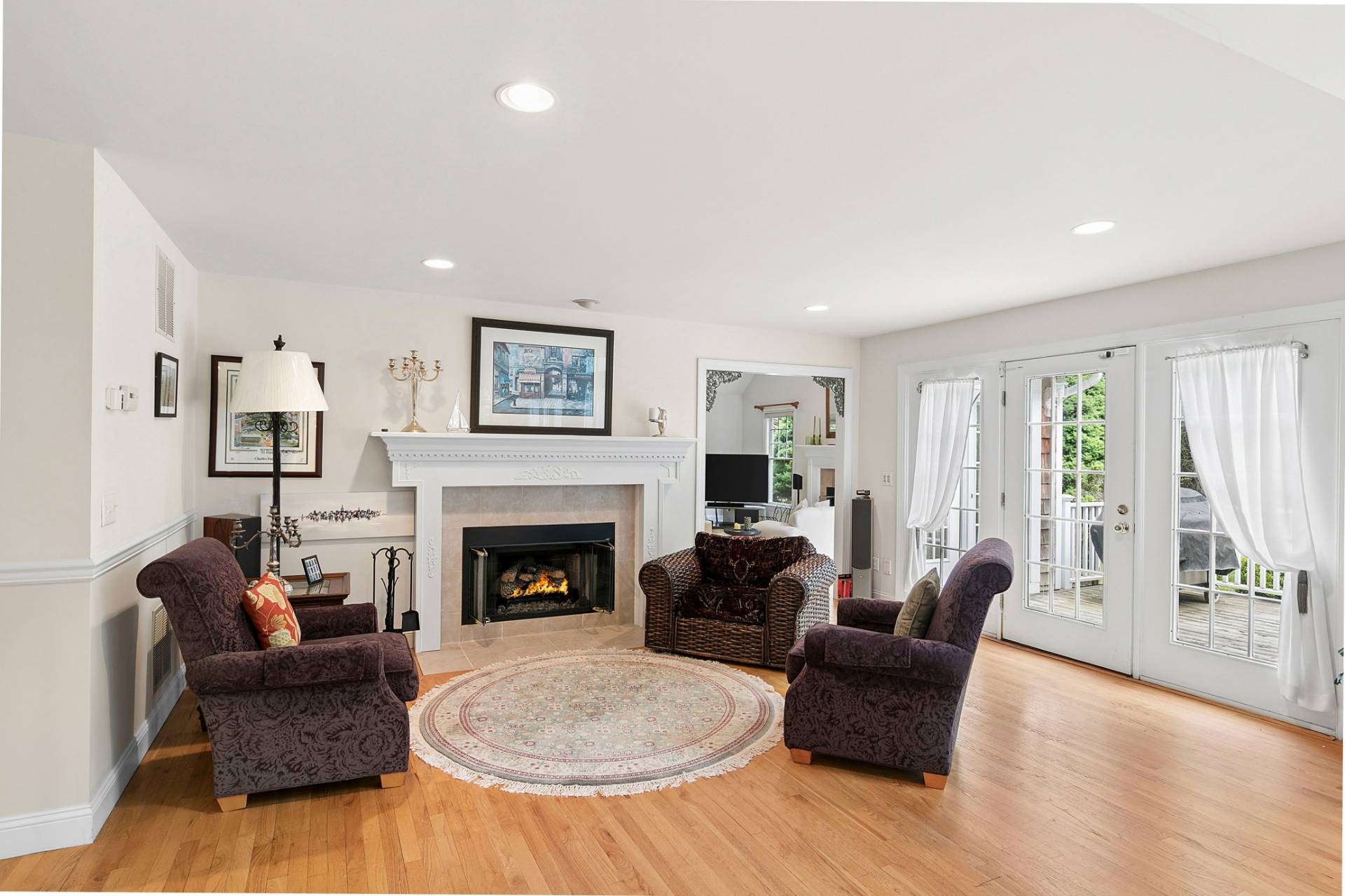 1557 Millstone Road Sag Harbor, NY 11963 - Photo 3 of 12 a living room with furniture and a fireplace