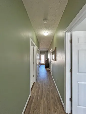 a view of gallery with wooden floor