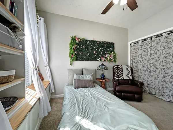 a bedroom with a bed and a couch