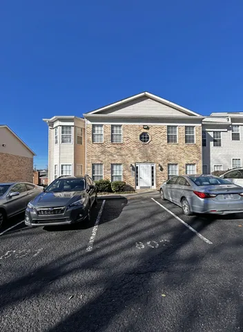 a view of a car parked in front of a house
