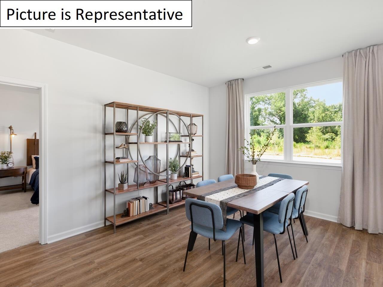 1120 Secrest Cmns Drive Monroe, NC 28112 - Photo 14 of 25 a view of a dining room with furniture window and wooden floor
