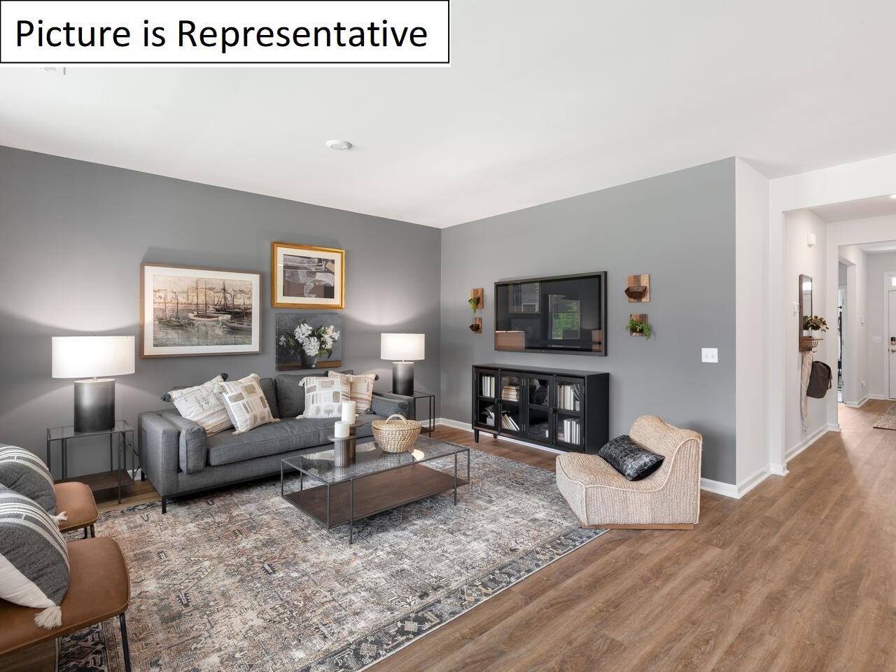 1120 Secrest Cmns Drive Monroe, NC 28112 - Photo 16 of 25 a living room with furniture and a flat screen tv