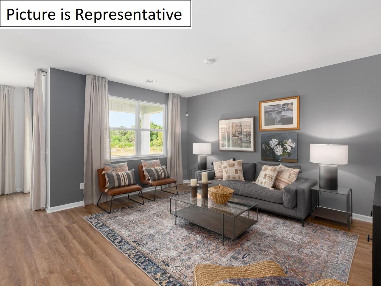 1120 Secrest Cmns Drive Monroe, NC 28112 - Photo 17 of 25 a living room with furniture and wooden floor