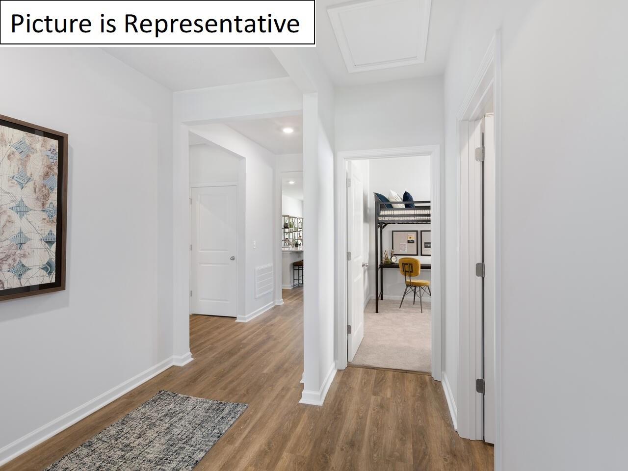 1120 Secrest Cmns Drive Monroe, NC 28112 - Photo 4 of 25 a view of a hallway with wooden floor and a living room
