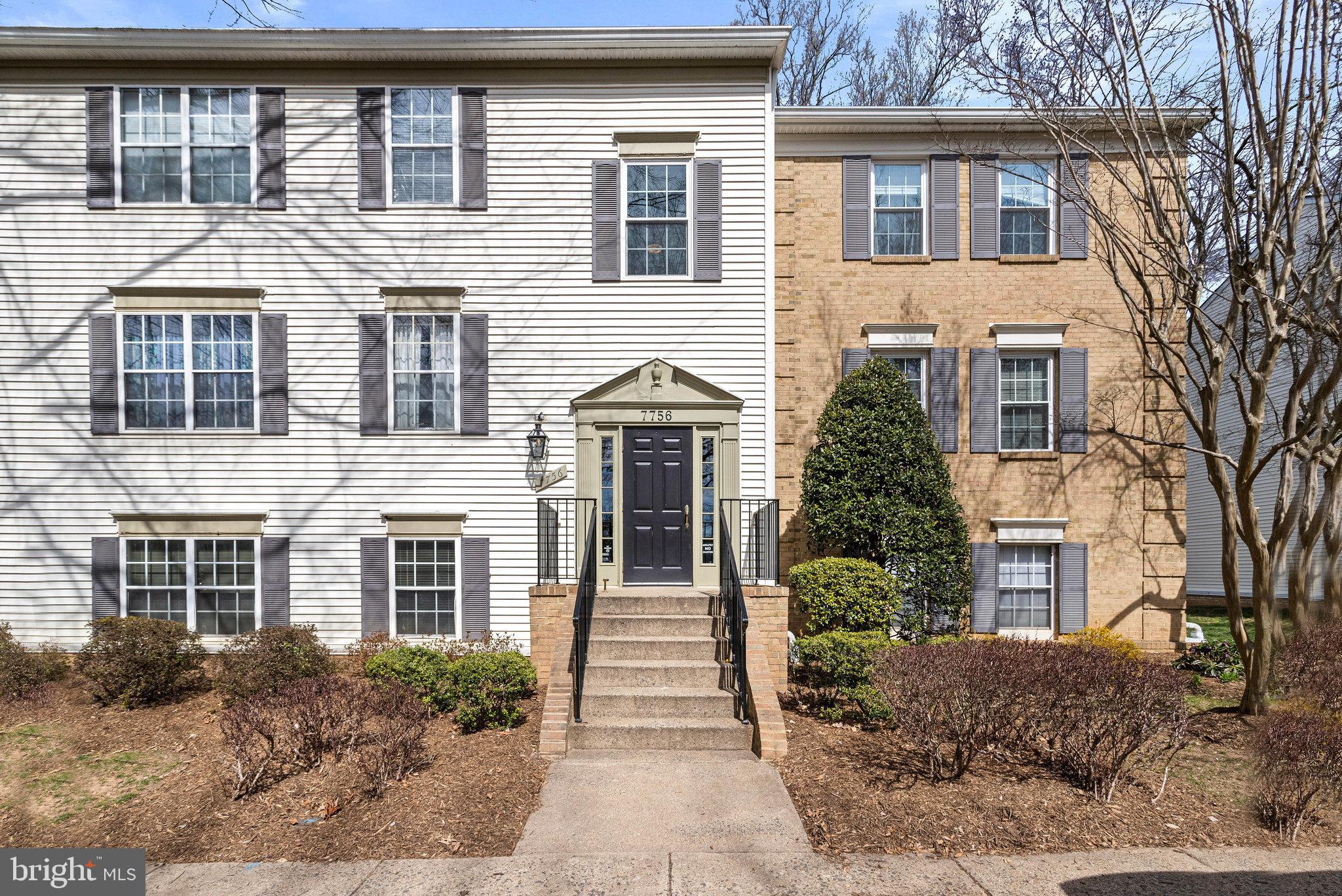 7756 New Providence Drive, Unit 13 Falls Church, VA 22042 - Photo 1 of 30 a front view of a house with garden