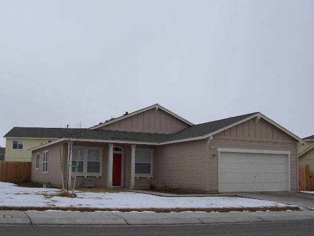 a front view of a house with a garage