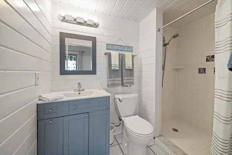 a bathroom with a toilet sink and shower