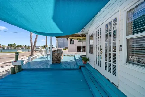 a view of a living room and a balcony