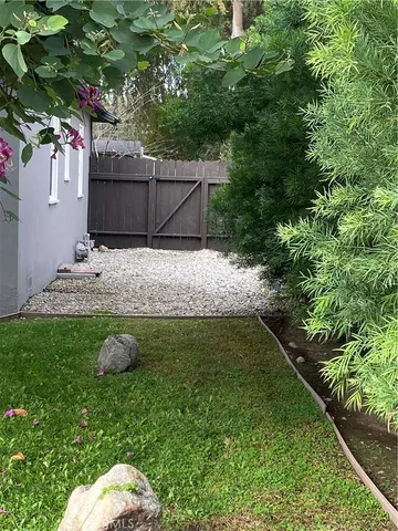 a view of basketball place with wooden fence
