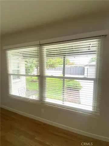 a view of a room that has a large window