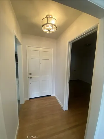 a kitchen with granite countertop a sink a stove and cabinets