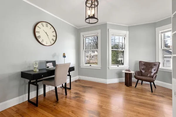 a view of a dining room with furniture window and wooden floor