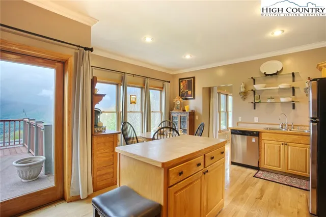 a kitchen with a stove a sink and a refrigerator