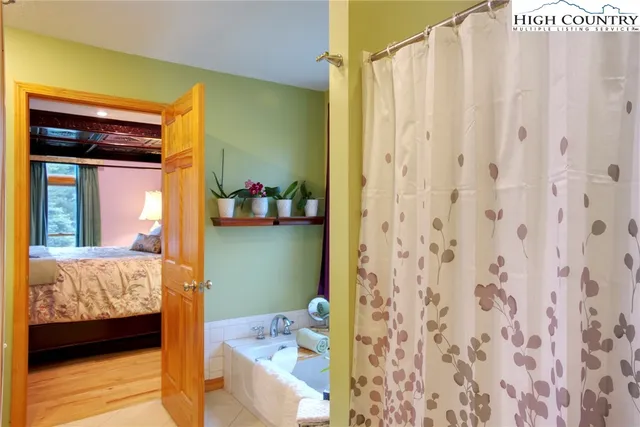 a bathroom with a sink mirror and vanity