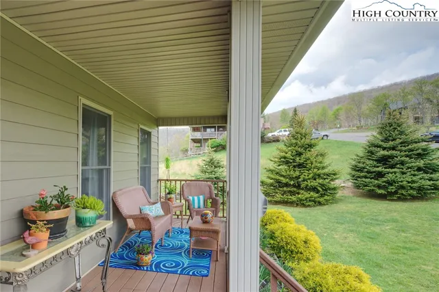 a living room with furniture a dining table and a fireplace
