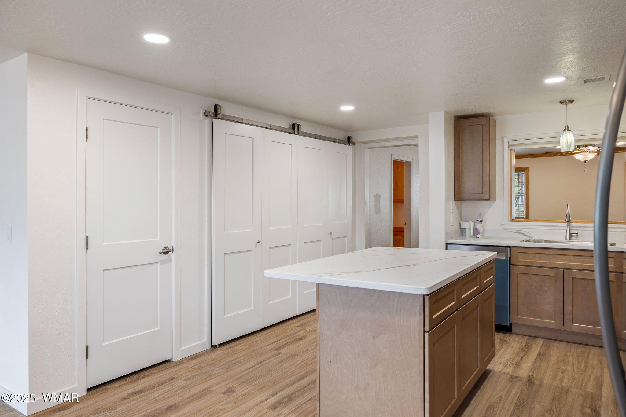 3368 Buckskin Canyon Road Heber, AZ 85928 - Photo 11 of 48 a kitchen with a sink refrigerator and cabinets