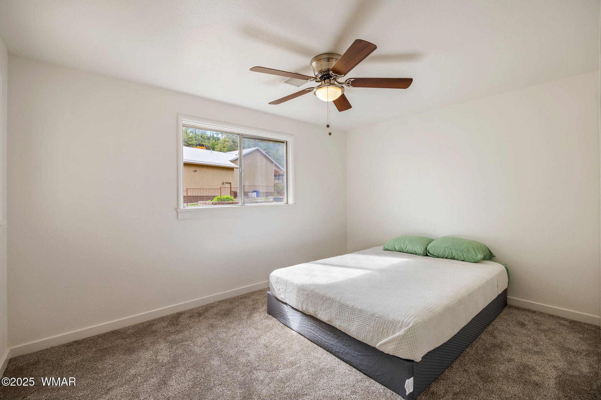 3368 Buckskin Canyon Road Heber, AZ 85928 - Photo 13 of 48 a bedroom with a bed and window